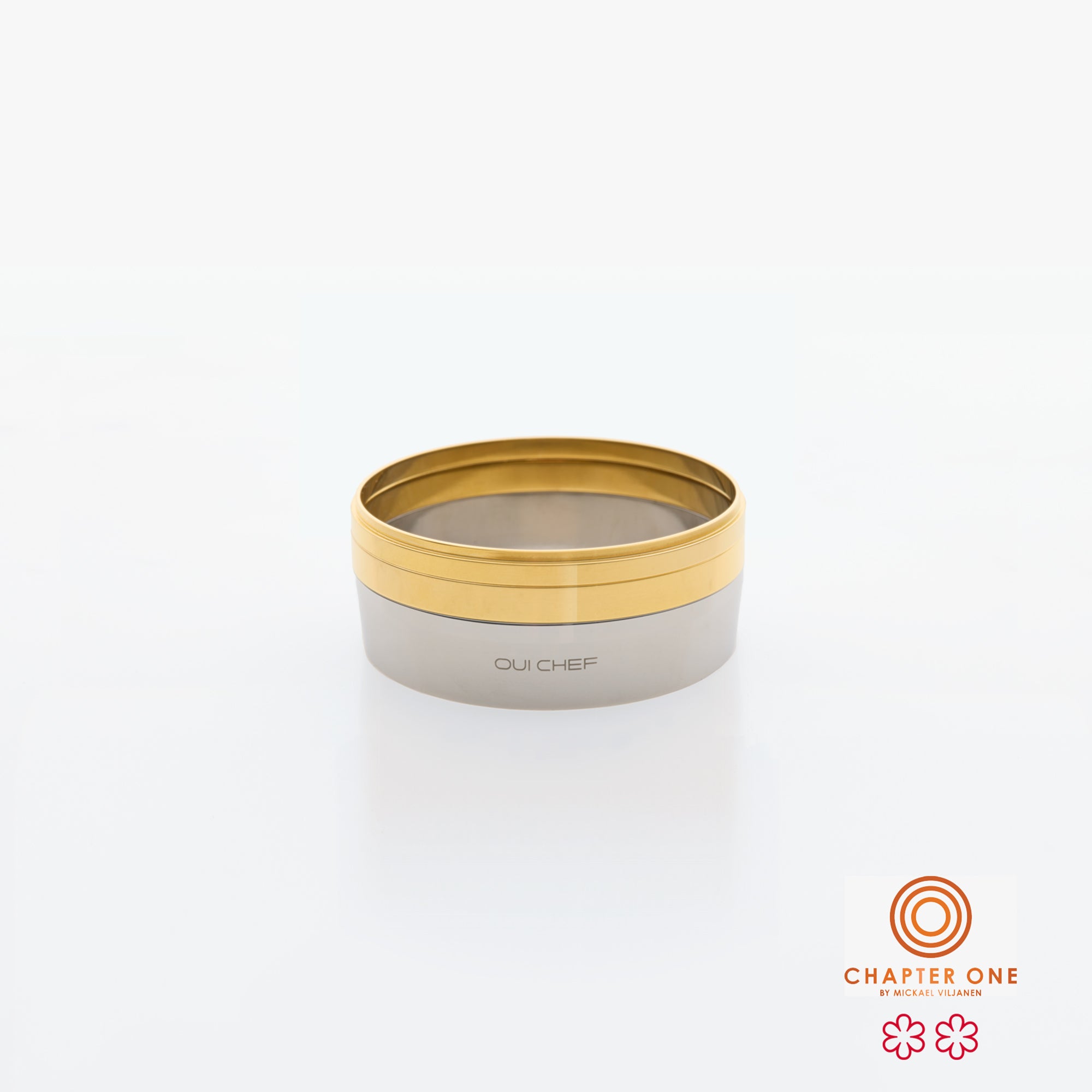 Stack of gray and gold containers with 'Chapter One' logo on a white background