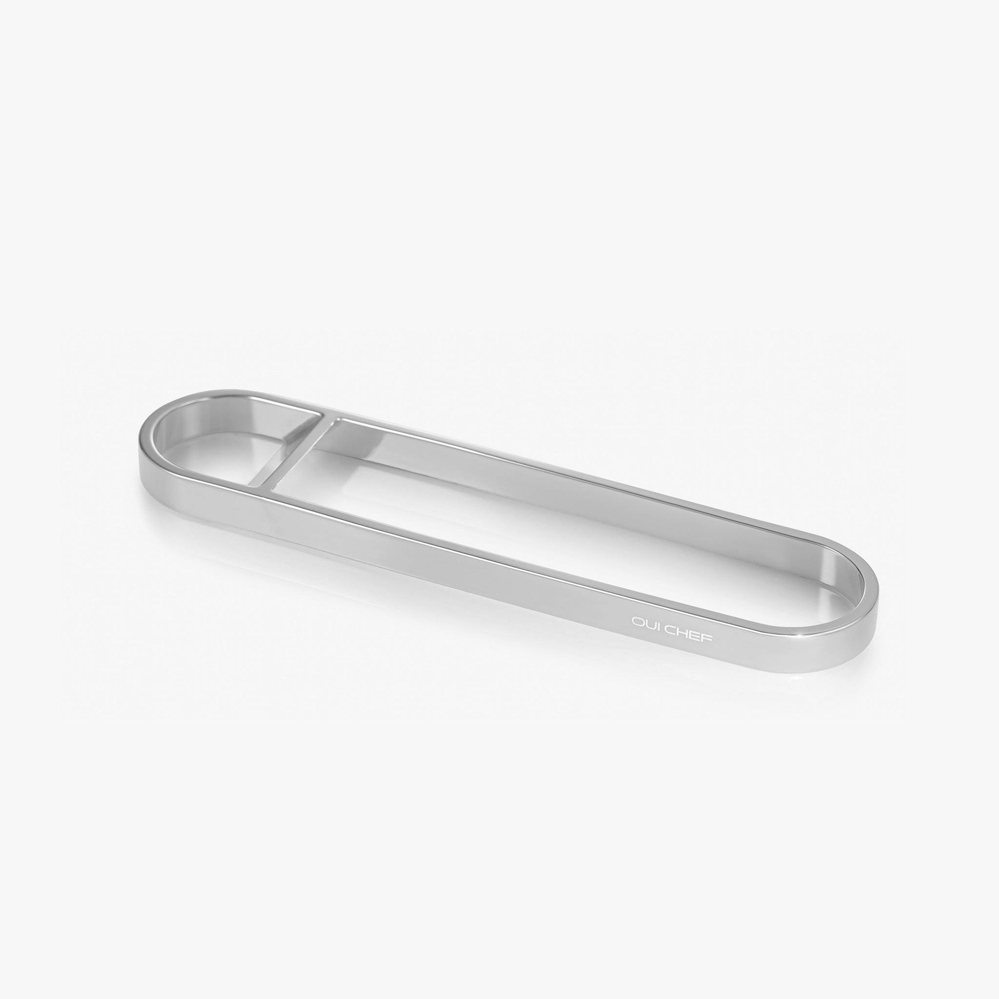 Chrome stainless steel bottle opener sitting against a white background with "oui chef" engraved on the side.