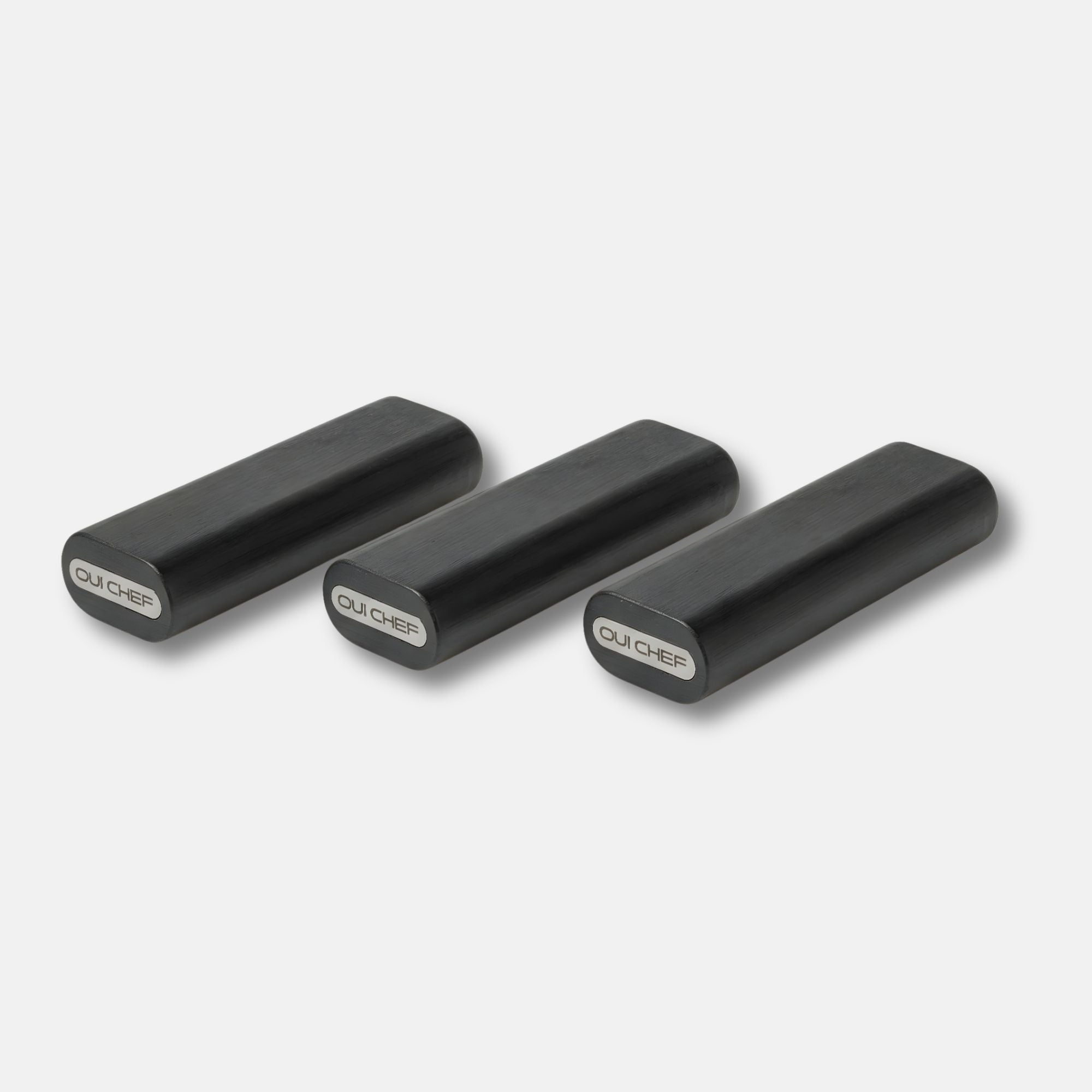 Three Modular laylow knife rests side by side sitting against a white background with the "oui chef" logo displayed on the side.